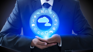 A businessman holding a cloud computing icon, symbolizing technology and innovation in the business world.