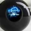 The image displays a black sphere resembling a "magic 8-ball," with a digital graphic inside the circle of the ball. The graphic shows a businessperson’s hands holding holographic cloud icons, symbolizing cloud computing and various related devices. To the right of the sphere, the text reads "Managed Cloud Services Trends for 2025: What Your Business Needs to Know." The bottom-left corner of the image features the COMtuity logo with the tagline "Technology Ingenuity." The overall theme is professional and tech-focused, emphasizing cloud services and future trends.